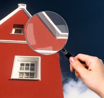 magnifying glass checking house