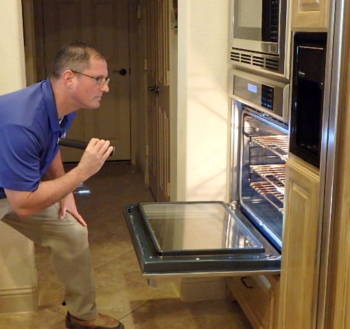 home inspector checking oven