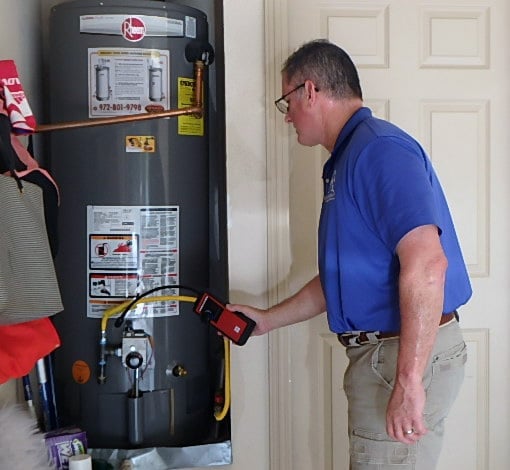 home inspector checking water heater