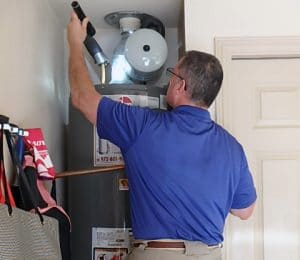 home inspector checking water heater