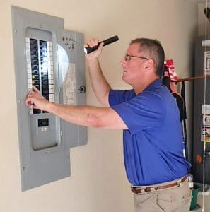 home inspector checking electrical panel