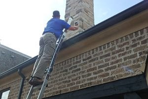 home inspector checking roof