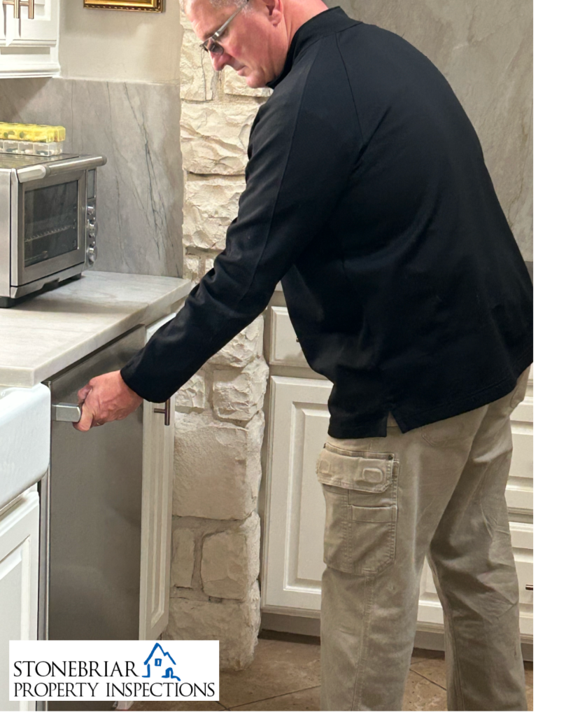Stonebriar Property Inspections inspector inspecting dishwasher