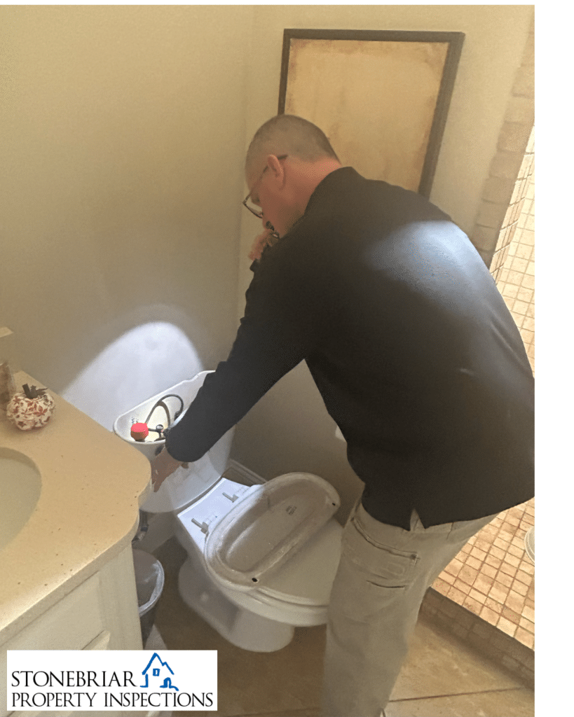 Stonebriar Property Inspections inspector inspecting toilet